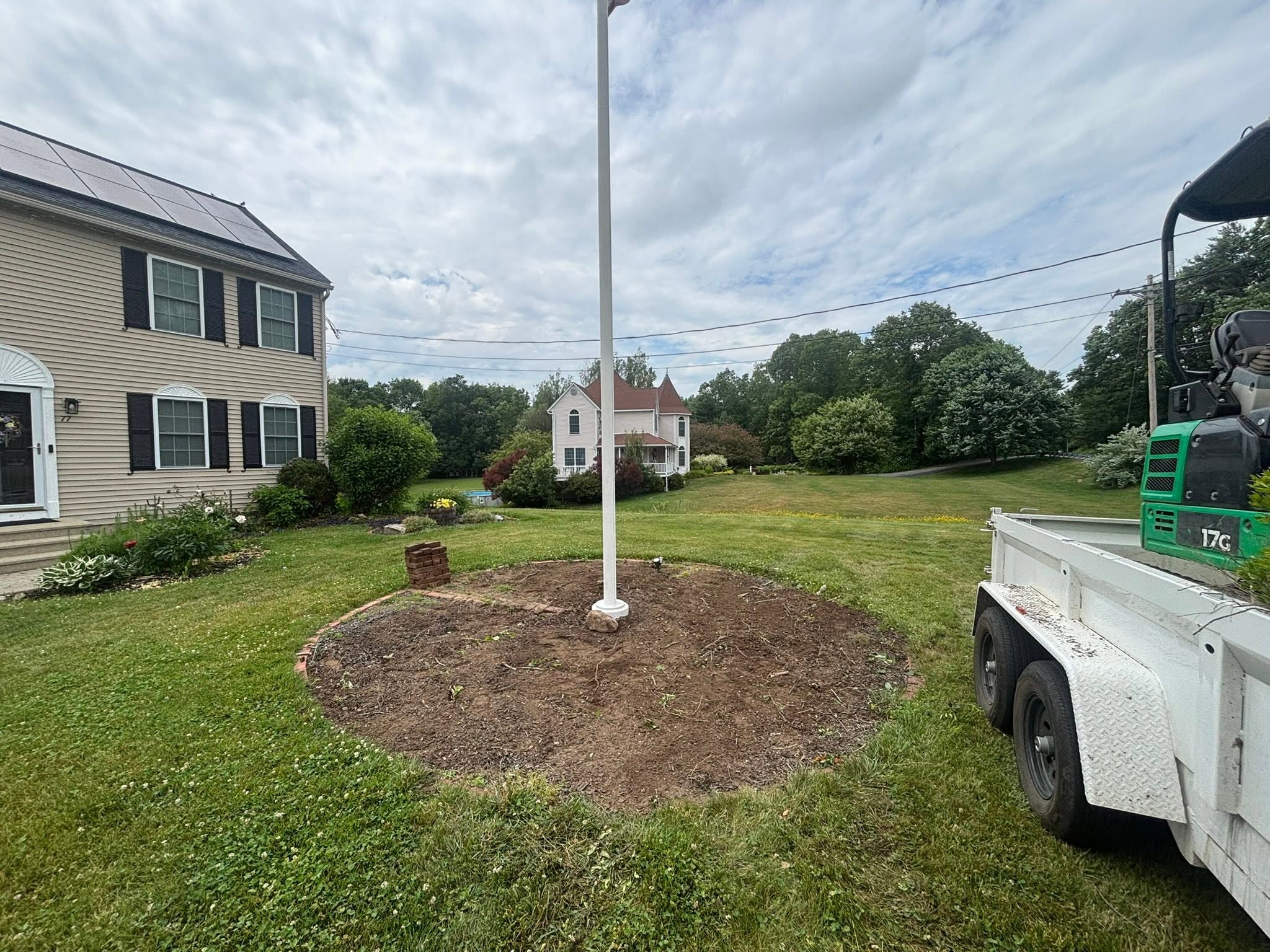 After photo — cleared landscape area with clean grade
